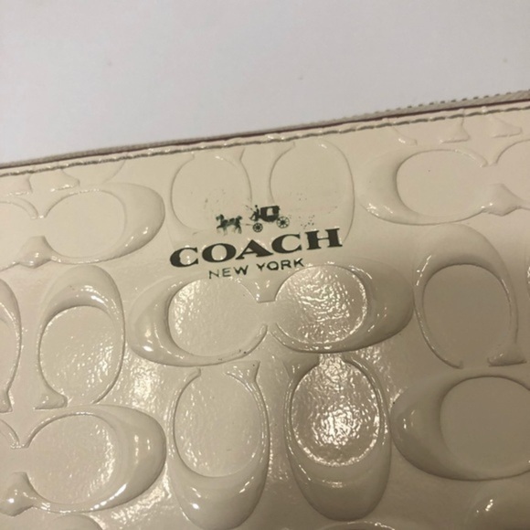 Coach debossed creamy white double zipper wristlet